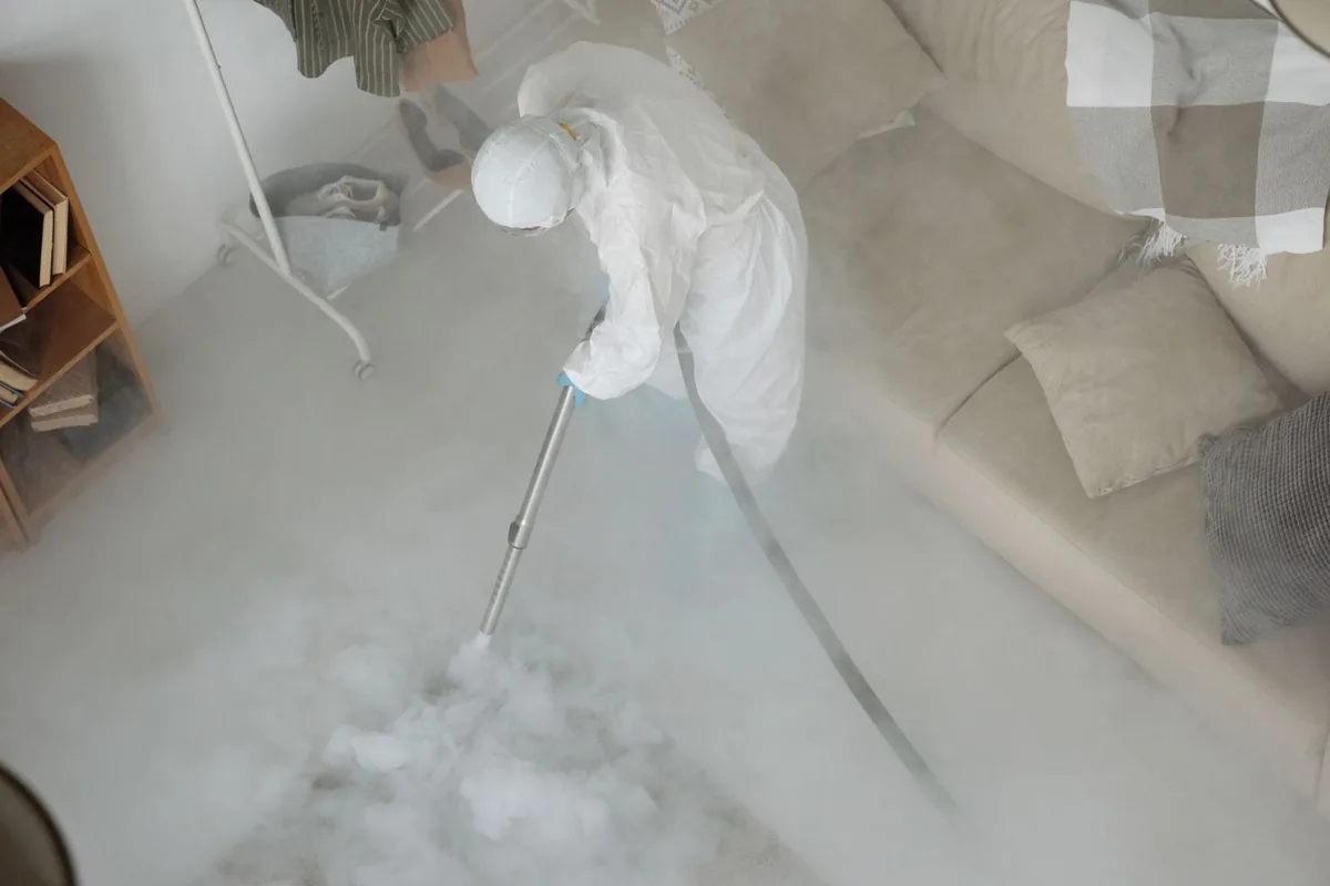 Biohazard cleanup technician in protective equipment, Hastings-on-Hudson, NY